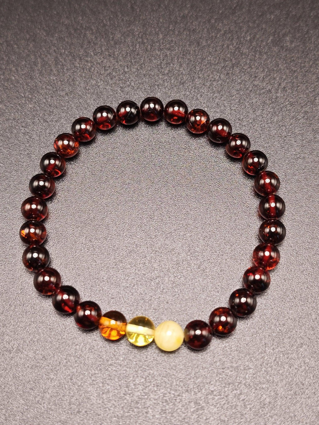 Bernstein-Armband mit roten, orangen und gelben Perlen, handgefertigt aus echtem Ostsee-Bernstein